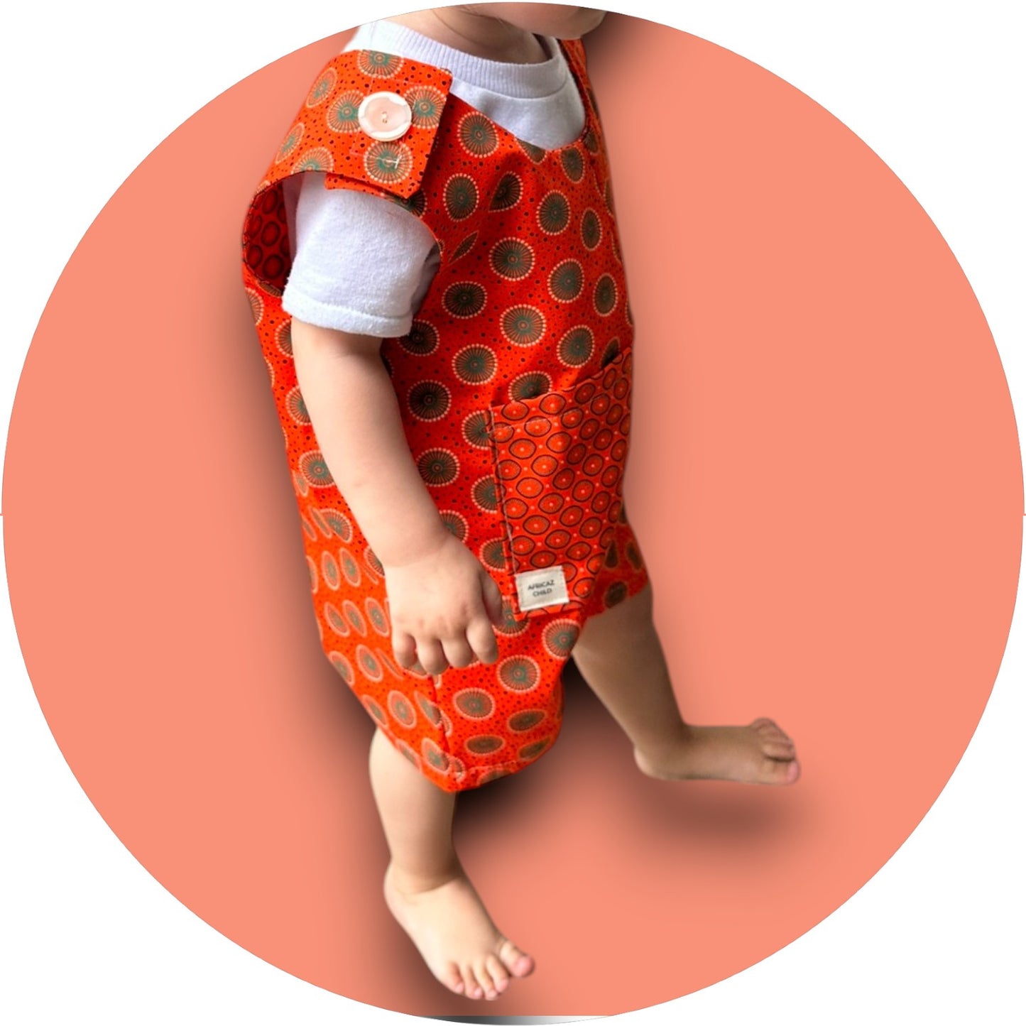 Baby orange shweshwe jumper with pocket