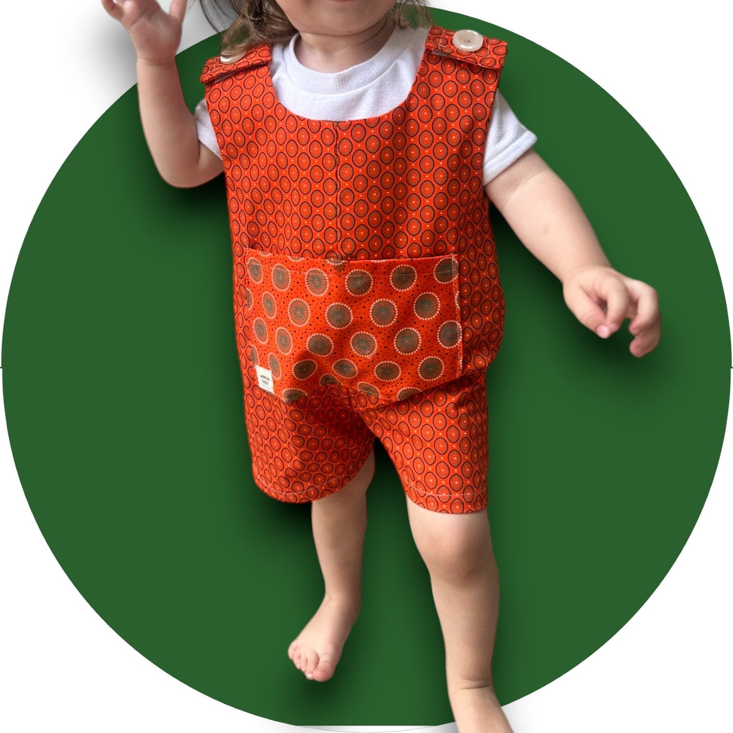 Baby orange shweshwe jumper with pocket