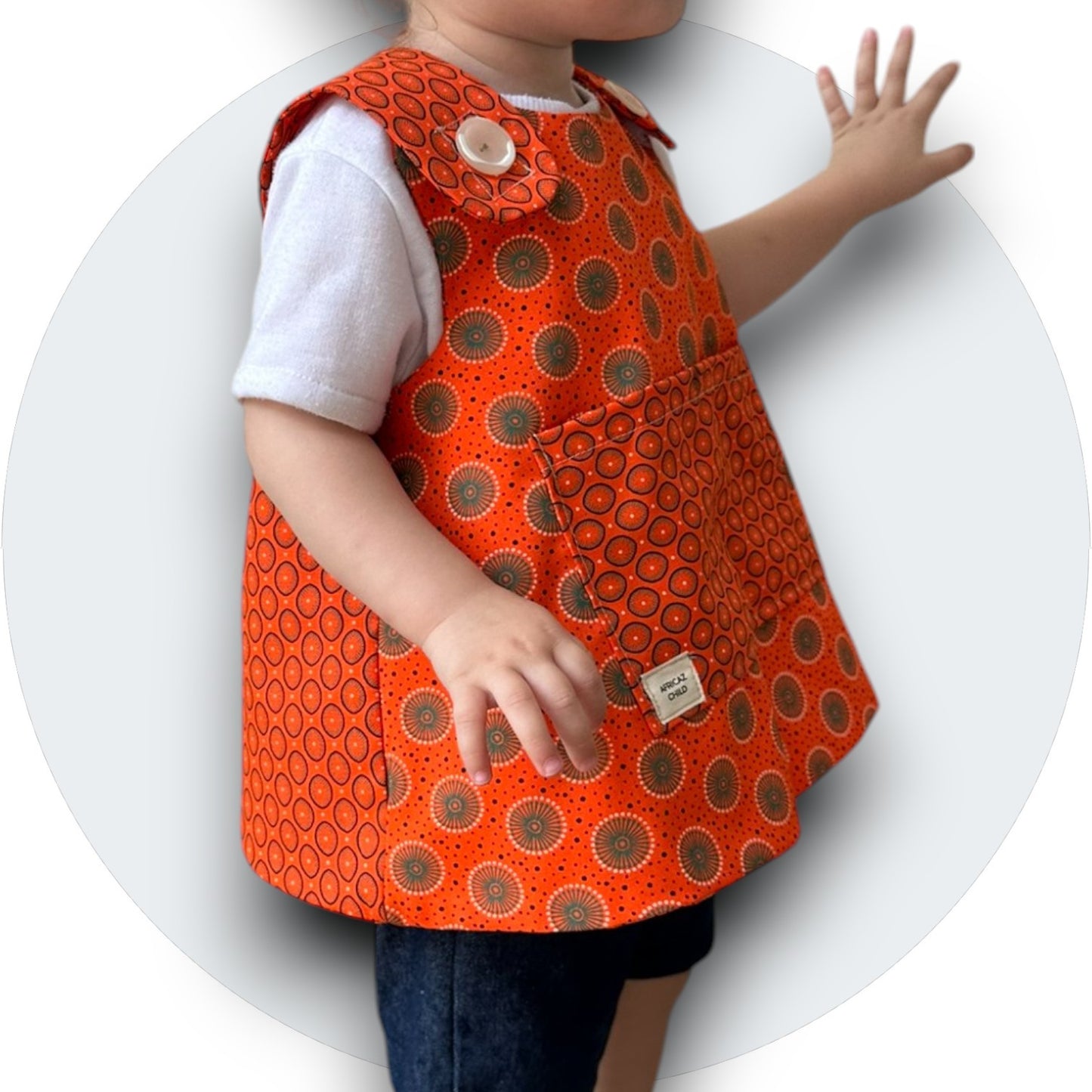 Baby orange shweshwe cross-over top with pocket