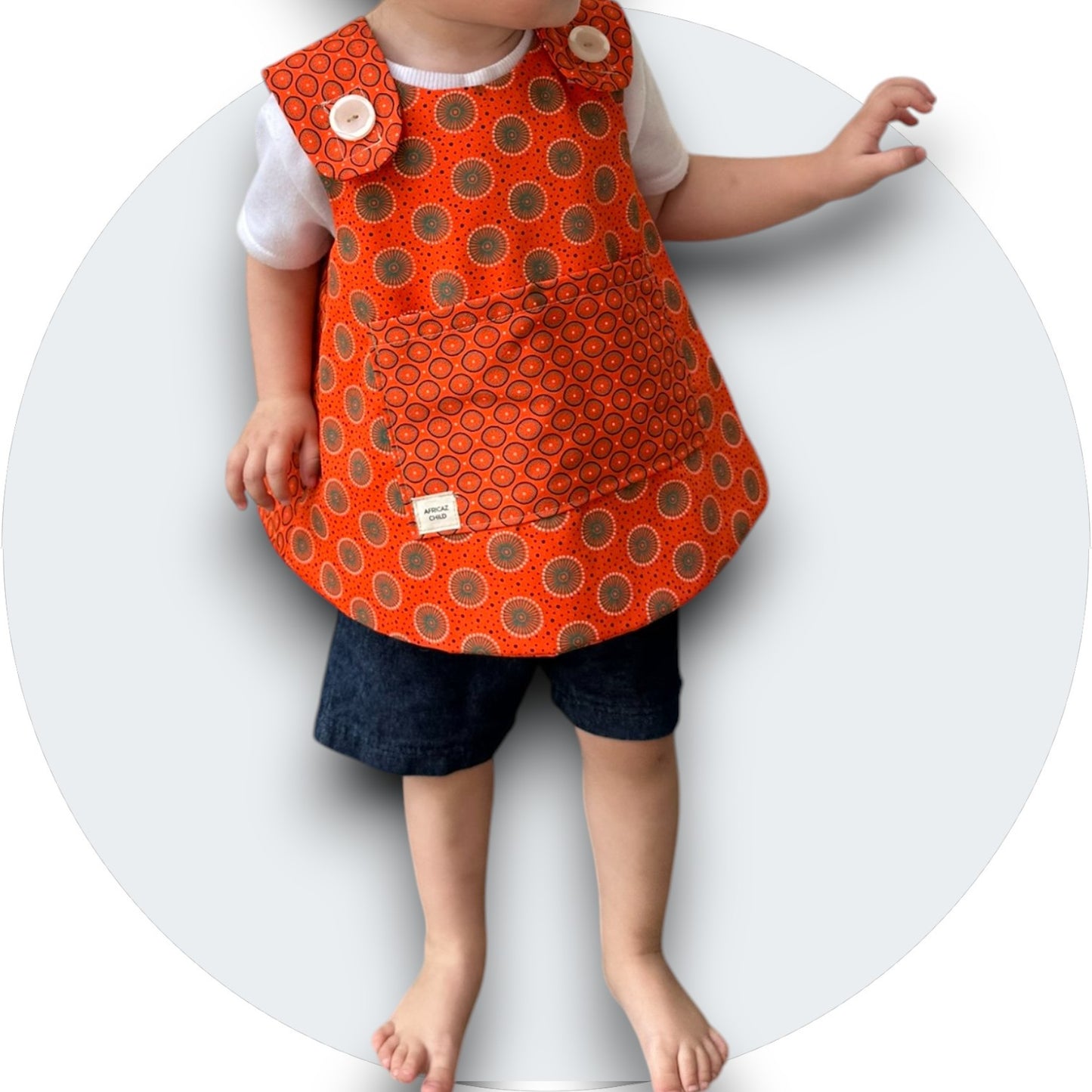Baby orange shweshwe cross-over top with pocket