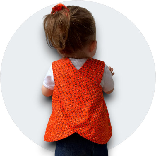 Baby orange shweshwe cross-over top with pocket