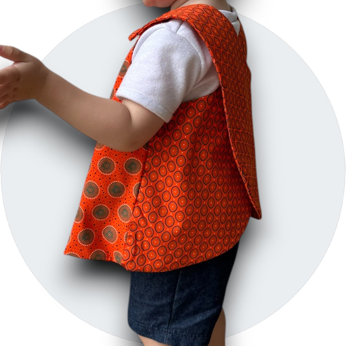 Baby orange shweshwe cross-over top with pocket