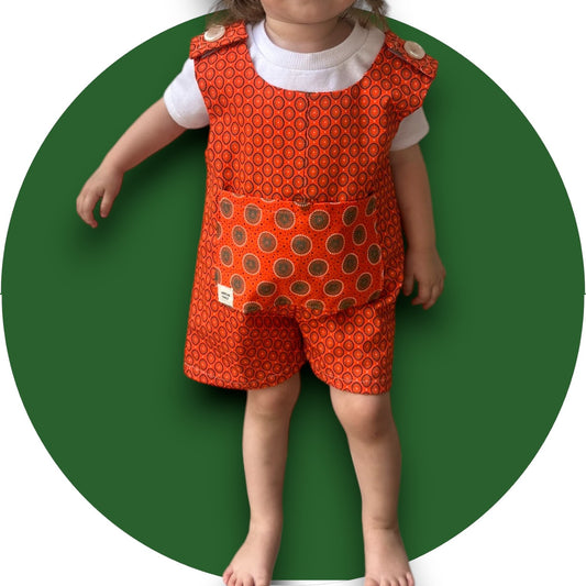 Baby orange shweshwe jumper with pocket