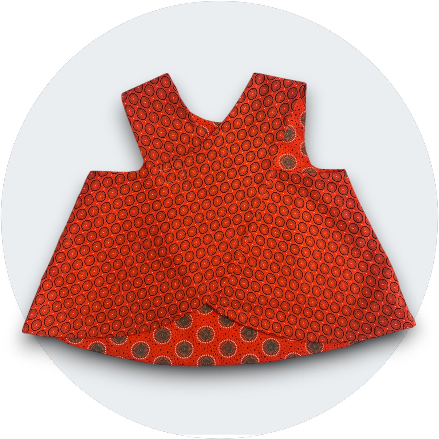 Baby orange shweshwe cross-over top with pocket