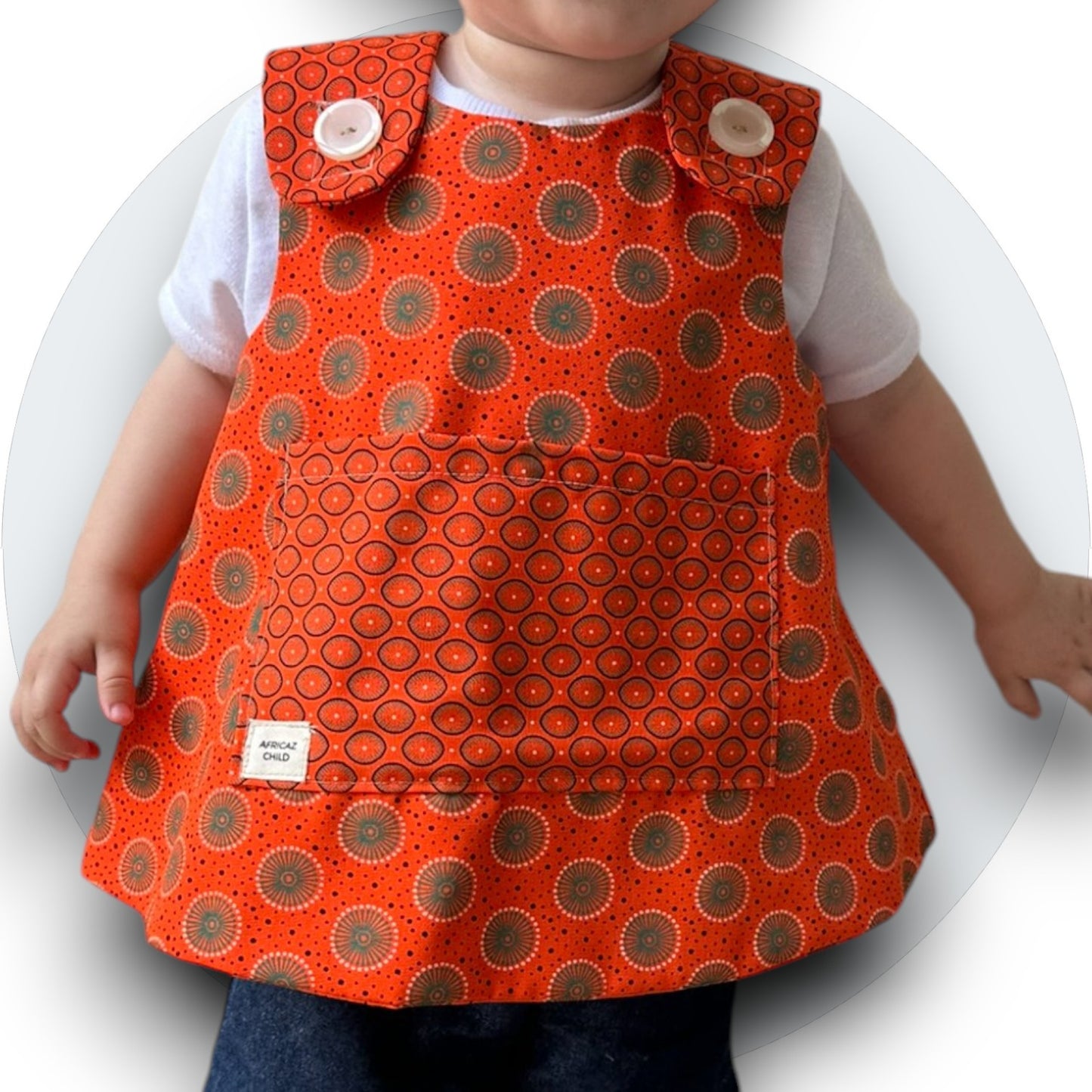 Baby orange shweshwe cross-over top with pocket